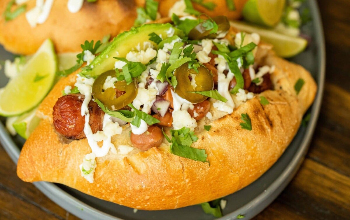 A Sonoran hot dog recipe on a plate.