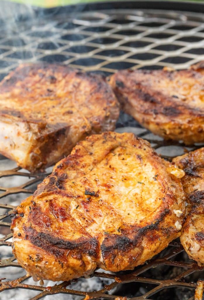 marinated German pork chops on the grill.