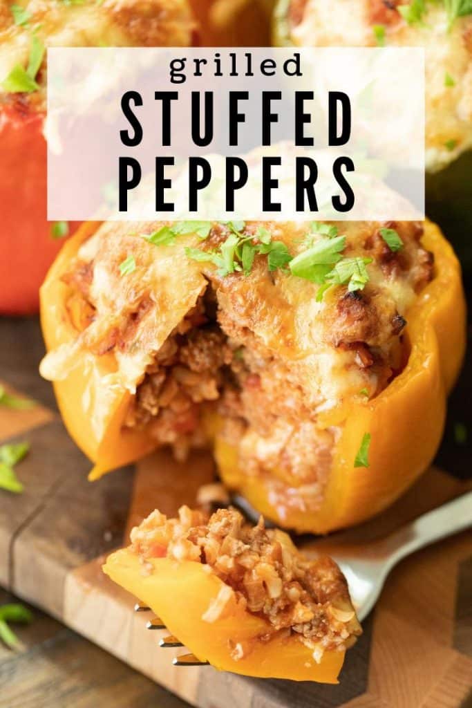 yellow bell pepper stuffed with meat and cheese. Slice cut out and resting on a fork.
