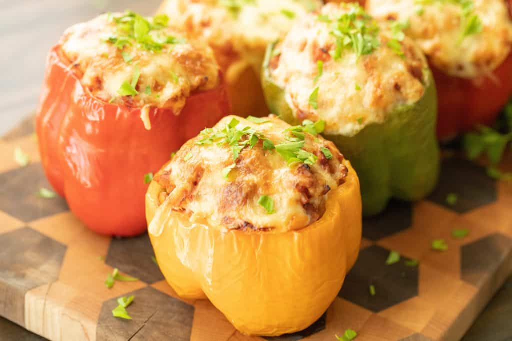 grilled stuffed bell peppers on a cutting board