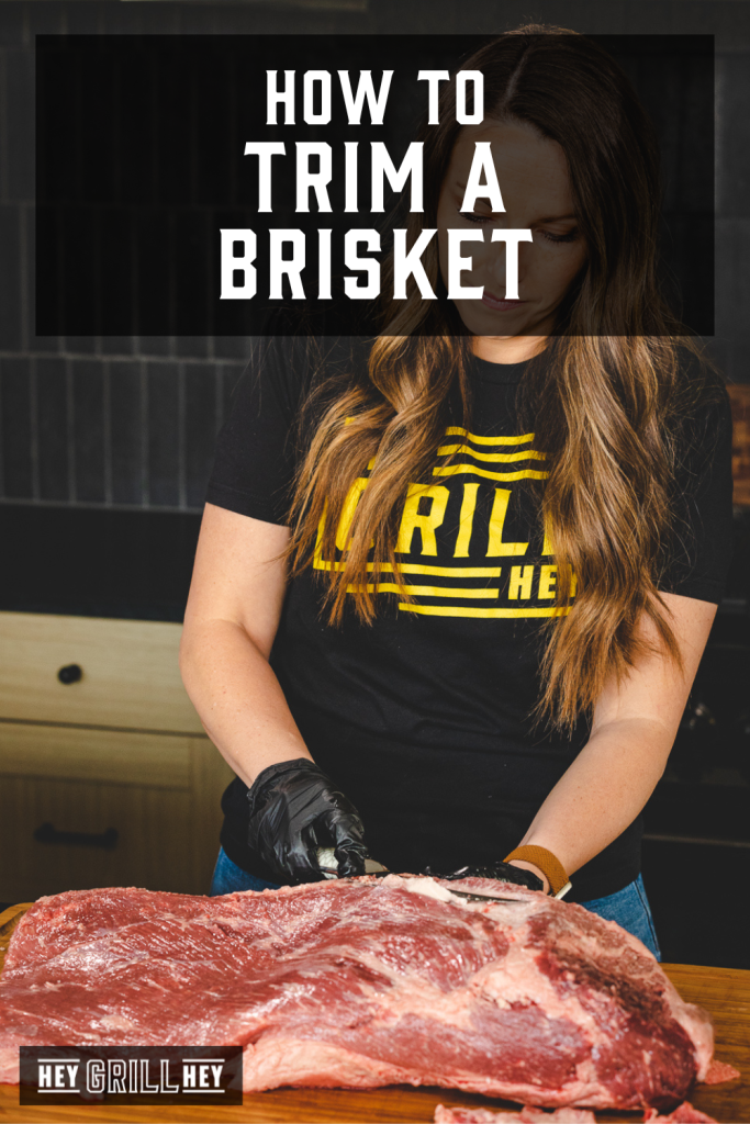 Susie trimming brisket on a wooden cutting board with text overlay - How to Trim a Brisket.
