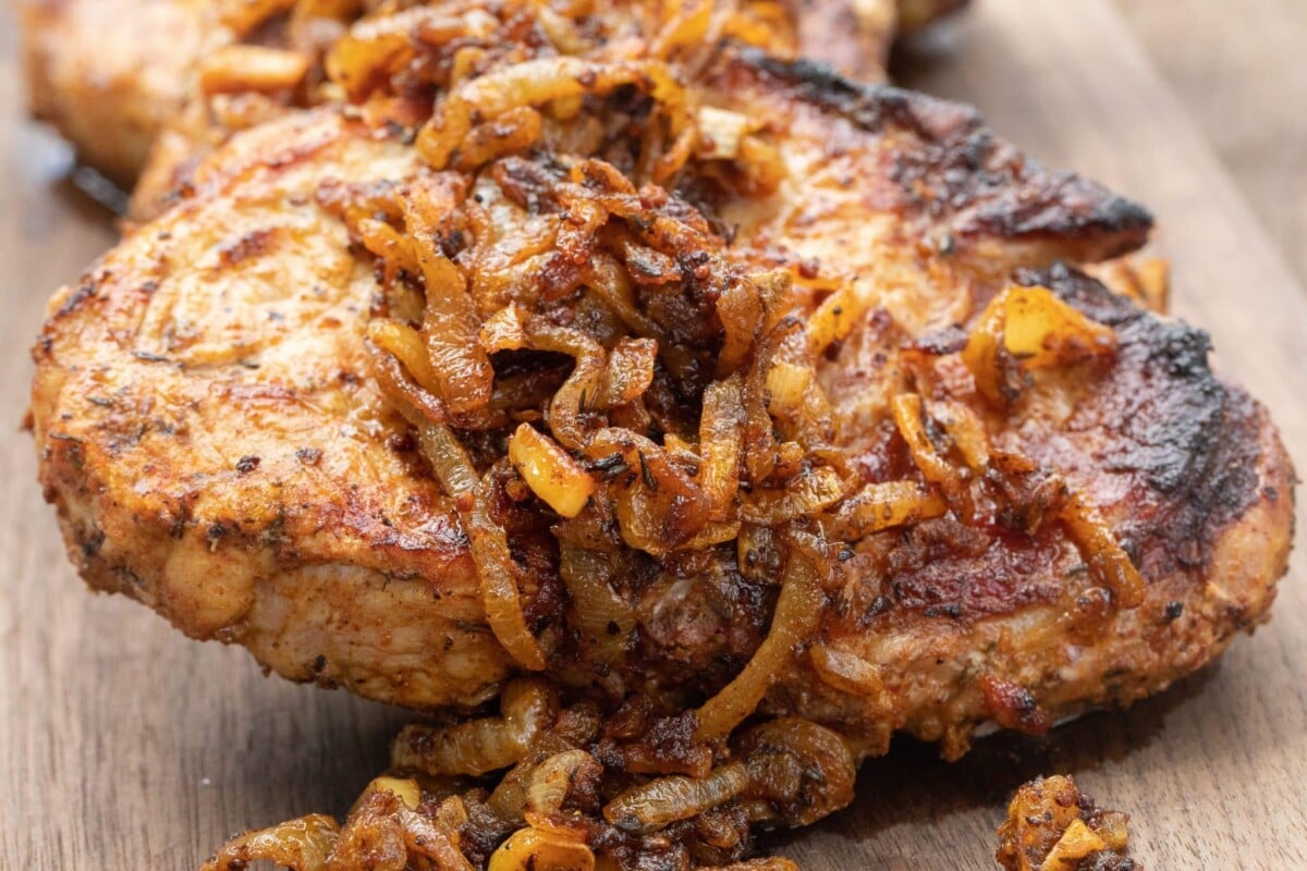 Grilled chicken on a cutting board.