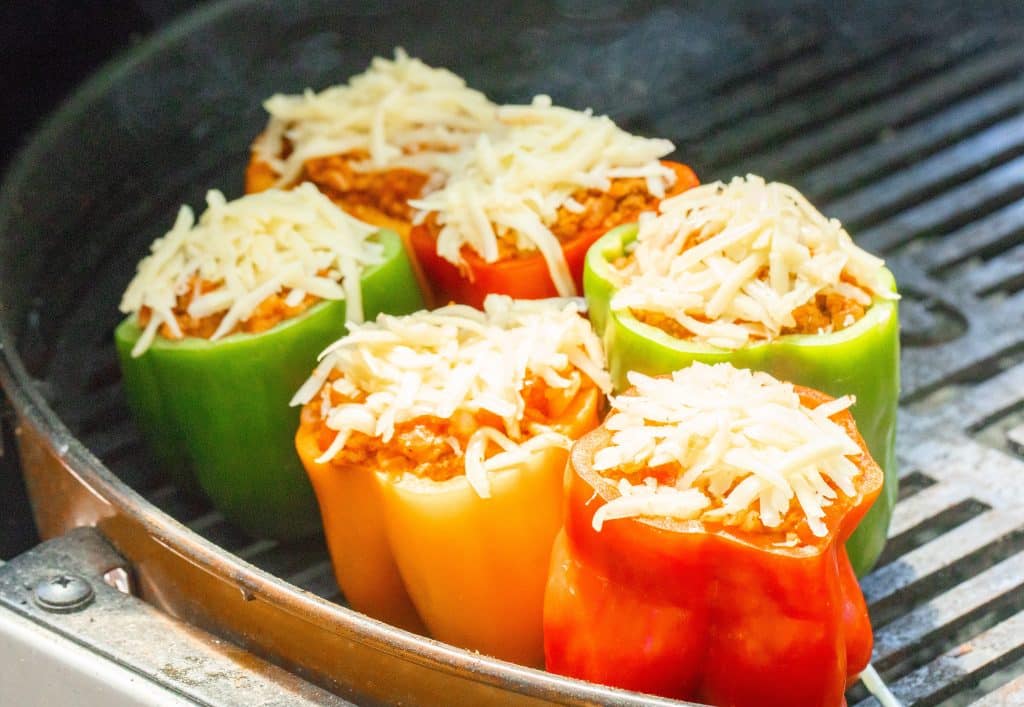 6 stuffed bell peppers on a grill