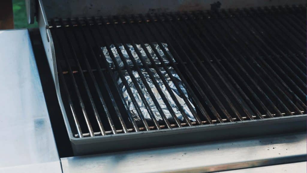 wood chip foil pouch in a gas grill.