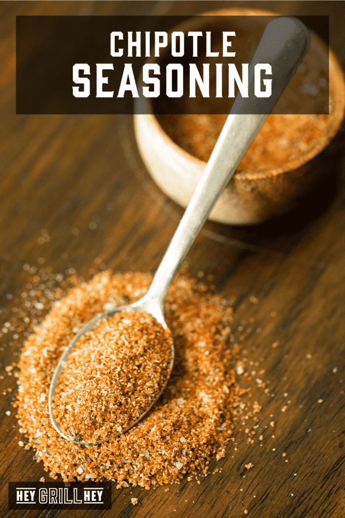 Spoonful of chipotle seasoning with text overlay - Chipotle Seasoning.