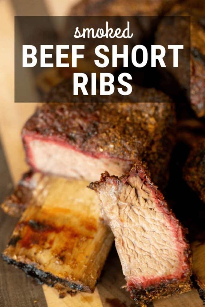 sliced beef short rib on a wooden cutting board.