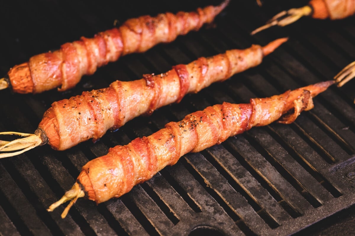 Carrots in bacon on the grill.