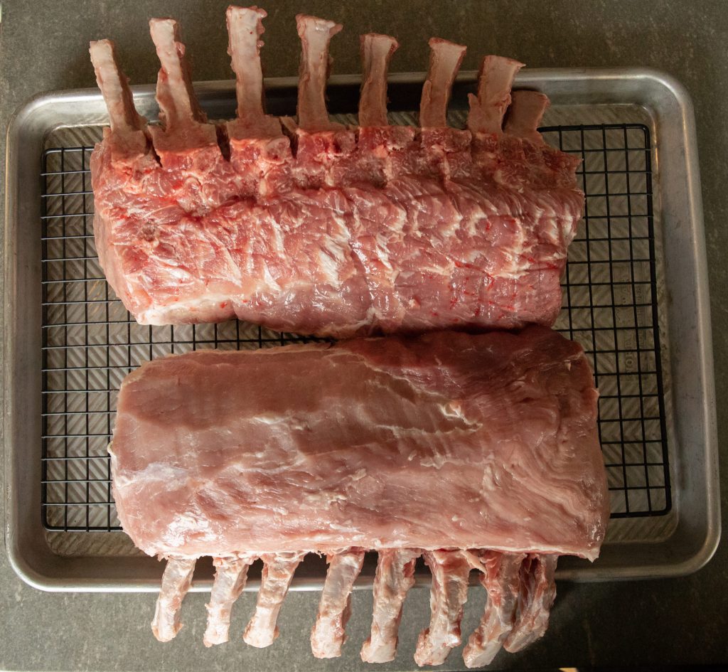 Trimmed Pork Roasts on a wire rack.