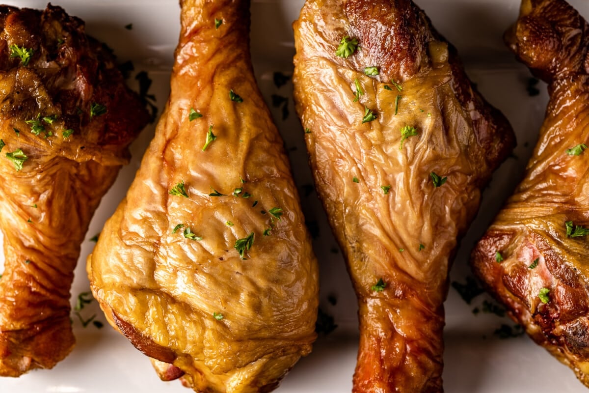 Turkey legs smoked on a plate.