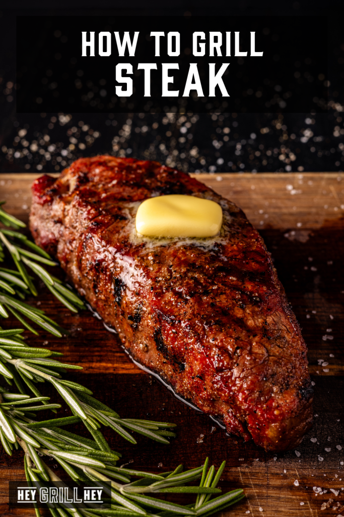 Grilled steak on a wooden cutting board with text overlay - How to Grill Steak.