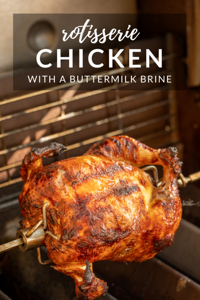 whole fryer chicken on a rotisserie spit in a grill. Text overlay reads, Rotisserie Chicken with a buttermilk brine.