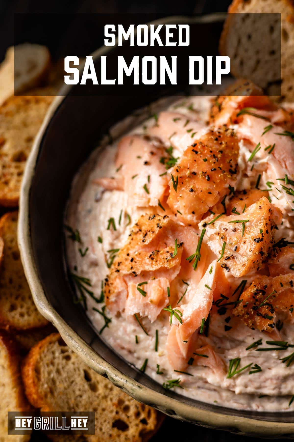 A bowl full of salmon sauce on a wooden table. The superimposed text is read "Smoked salmon sauce" above, and "Hey Grill, hey" in conclusion.