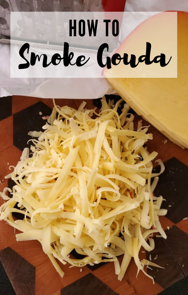 grated smoked gouda on a wooden cutting board. Text overlay reads "How to Smoke Gouda."