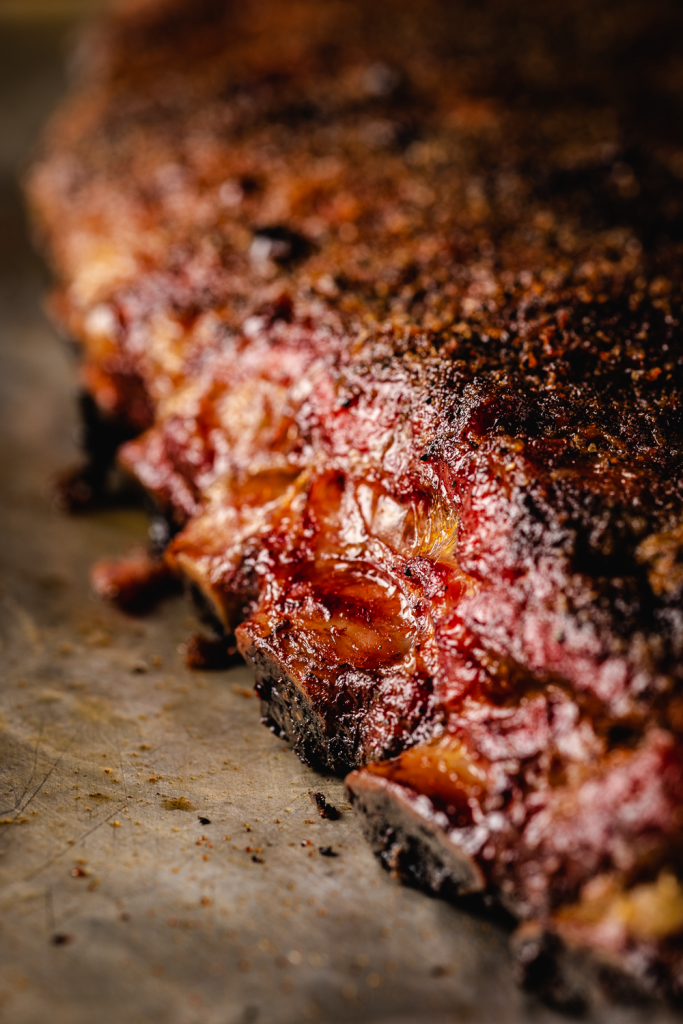 Close up of a rack of smoked spare ribs.