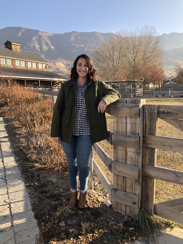 Susie Bulloch poses against a railing on a farm in Pleasant Grove, Utah.