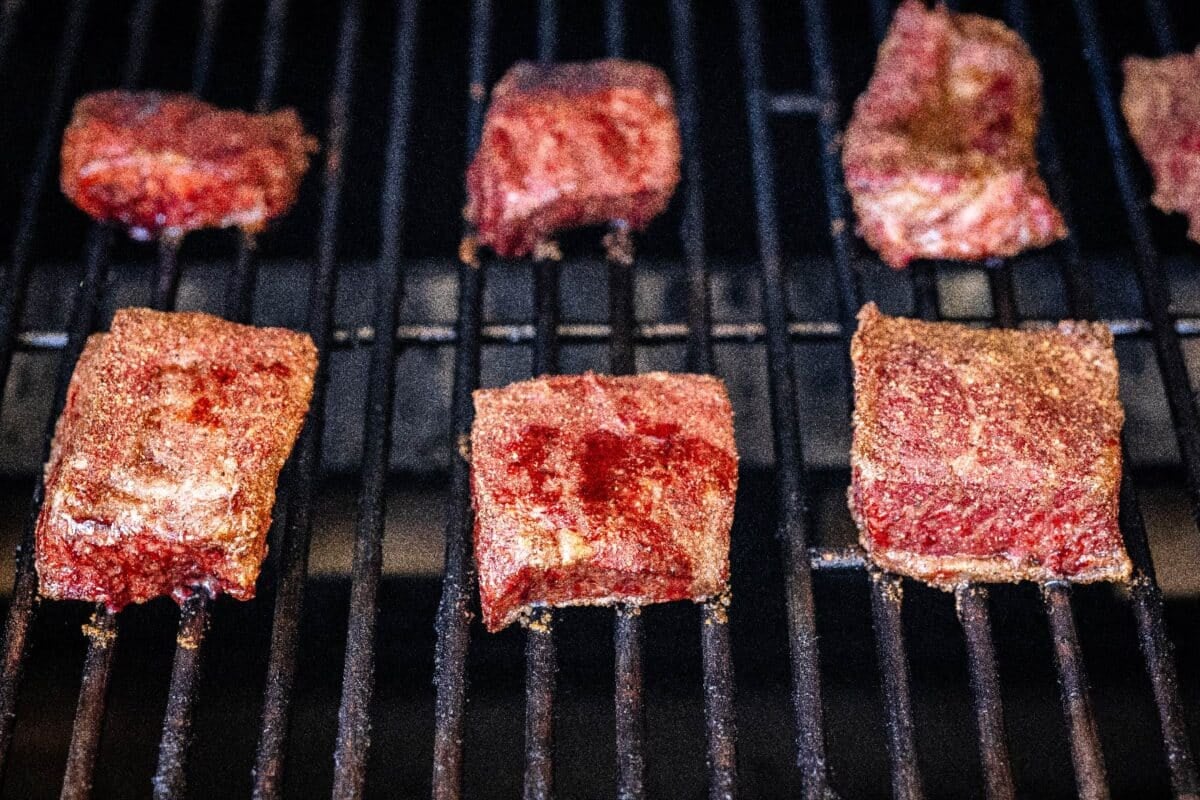 Boneless beef on smoker grates.