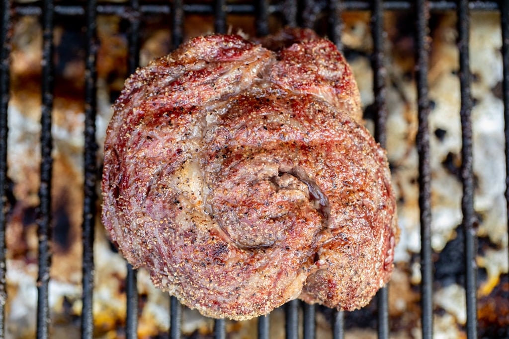 Overhead shot of a ribeye cap in the grill.