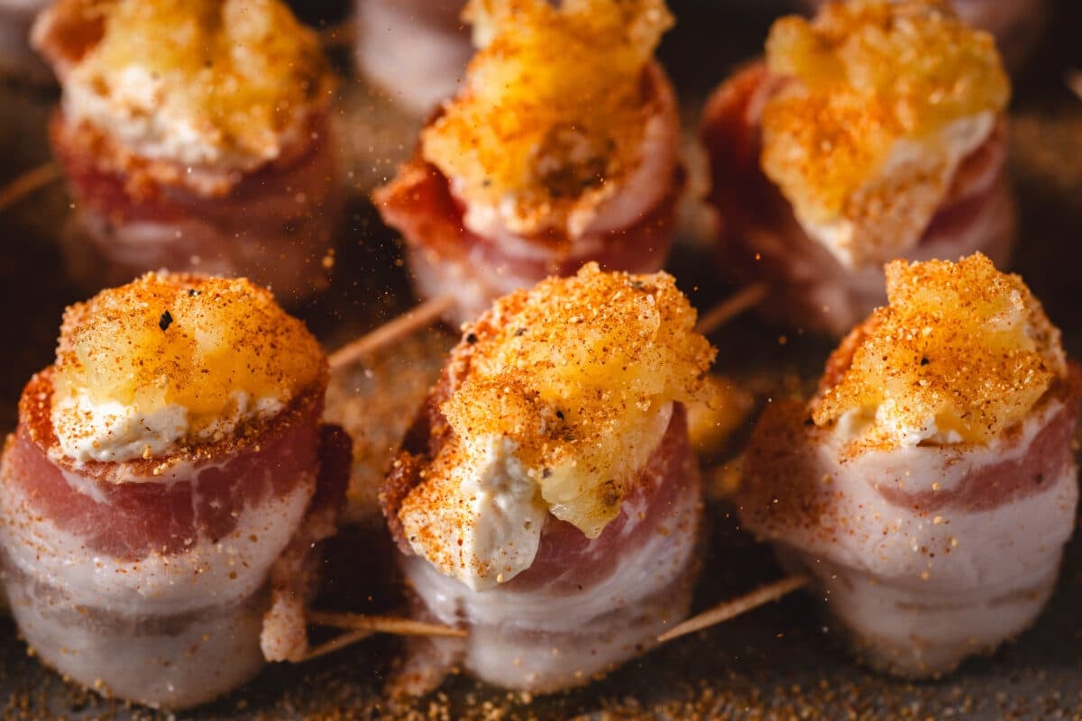 A closeup shot of pig shots on the grates of a smoker.