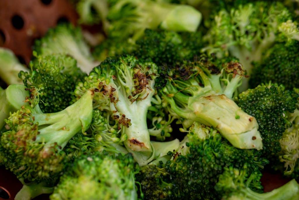 Close up of grilled broccoli florets.