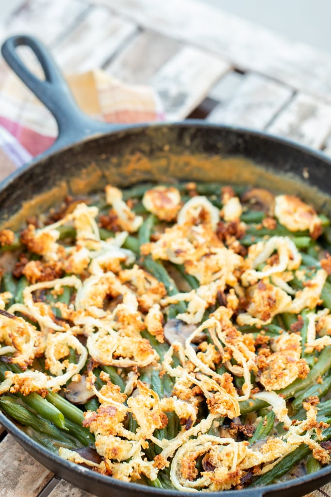 Smoked green bean casserole in a 12-inch case iron skillet.