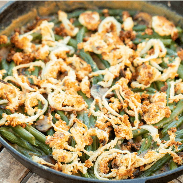 Smoked green bean casserole in a 12-inch cast iron skillet.