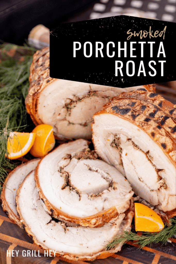 Sliced porchetta surrounded by lime wedges and fresh herbs on a wooden cutting board. Text overlay reads: Smoked Porchetta Roast.