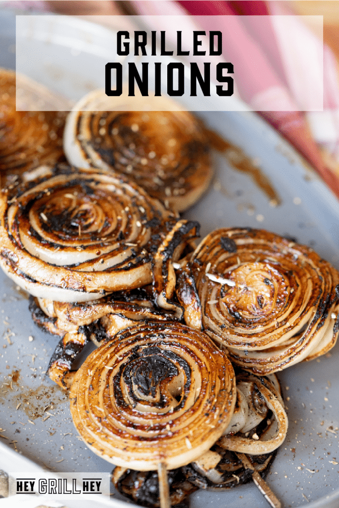 Marinated and grilled onions on skewers with text overlay - Grilled Onions.