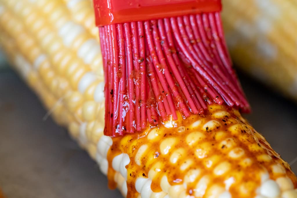 BBQ rub-seasoned butter being based on an ear of corn.