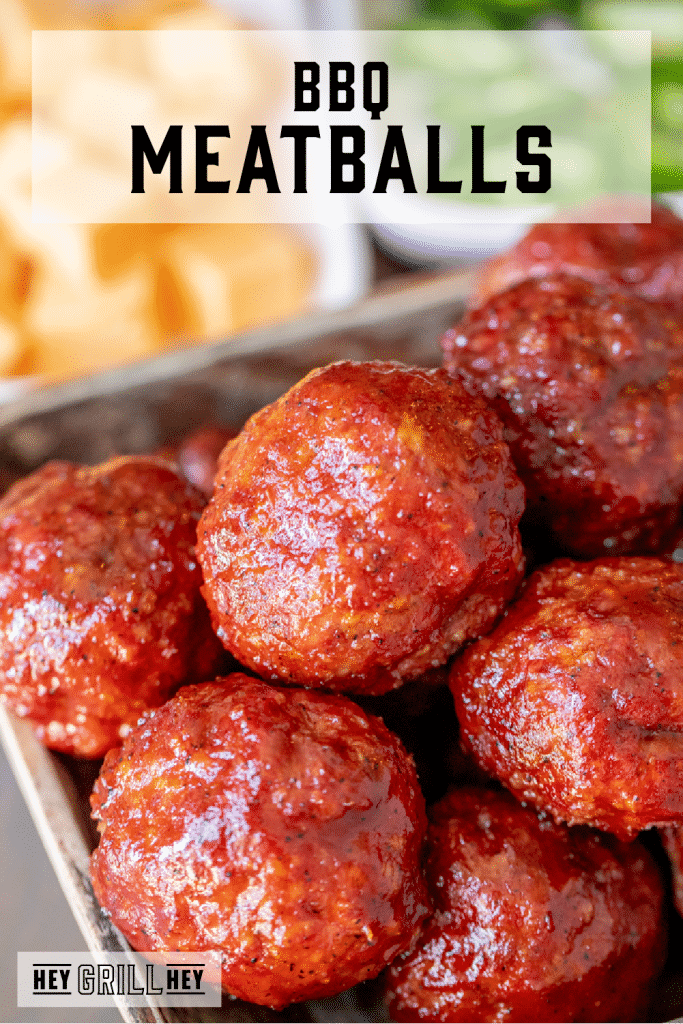 BBQ meatballs piled in a serving dish with text overlay - BBQ Meatballs.