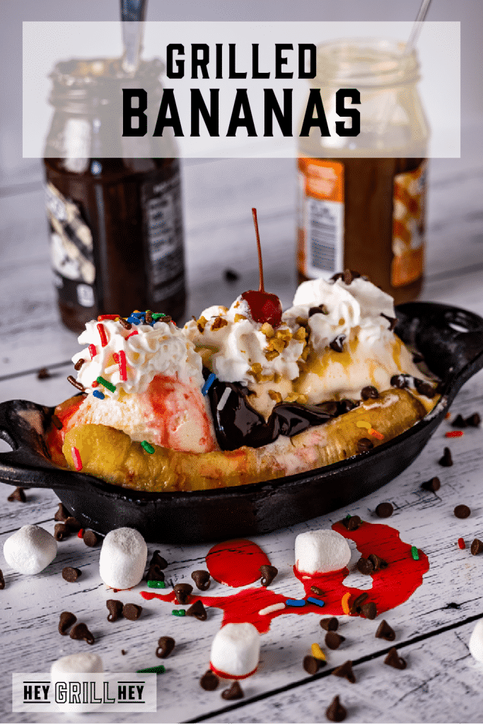 Grilled bananas topped with ice cream, sprinkles, and a cherry with text overlay - Grilled Bananas.
