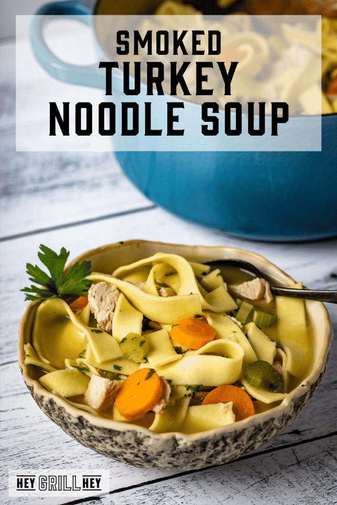 Bowl of smoked turkey noodle soup with text overlay - Smoked Turkey Noodle Soup.