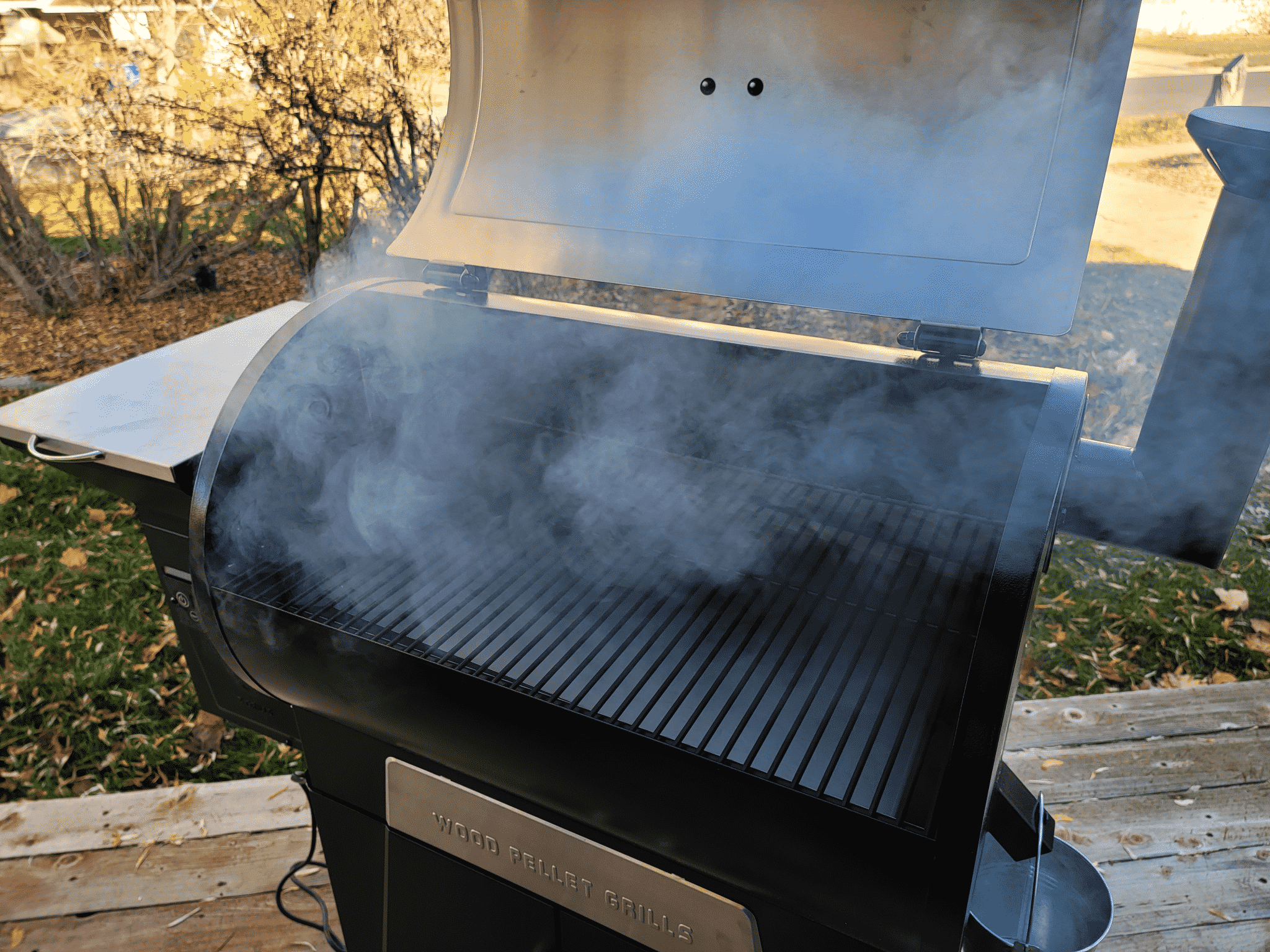 grill open with smoke pouring out