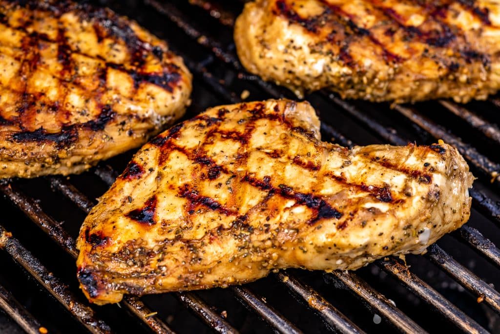 Balsamic marinated chicken breasts on the grill.
