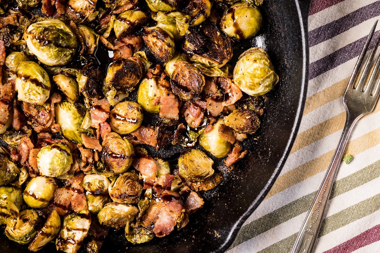 Skillet of glazed smoked Brussels sprouts.