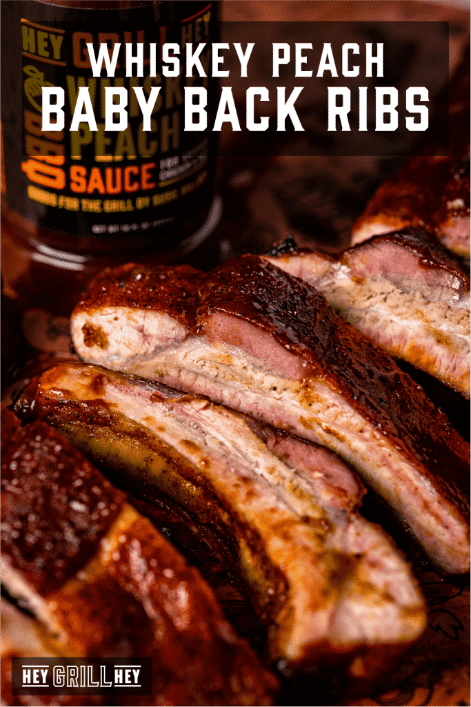 Sliced and smoked baby back ribs on a cutting board with text overlay - Smoked Baby Back Ribs.