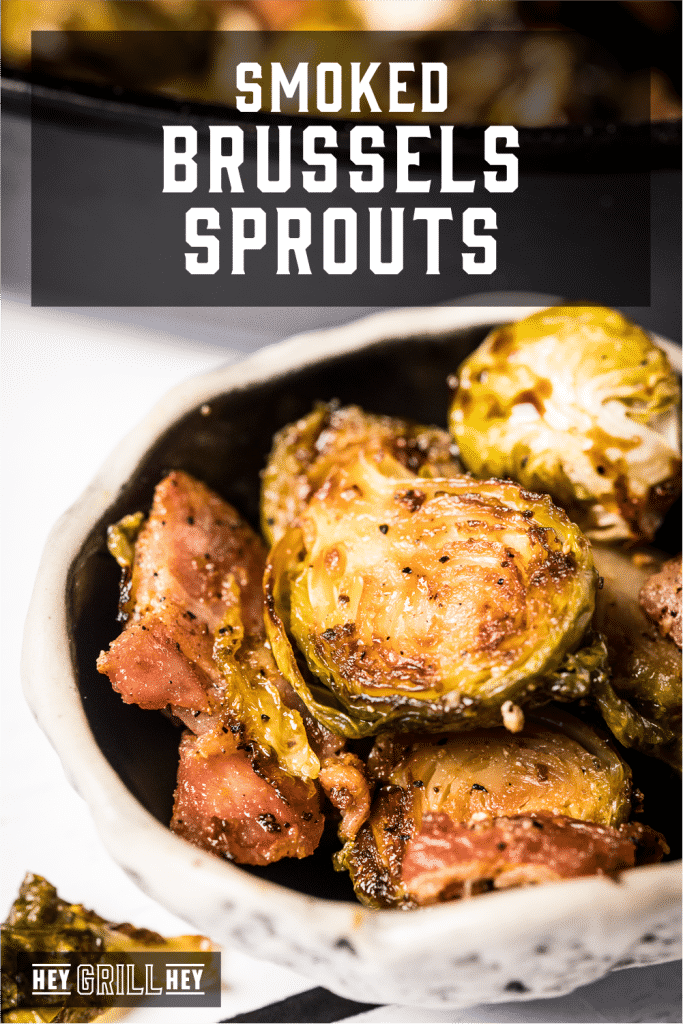 Smoked brussels sprouts in a serving dish with text overlay - Smoked Brussels Sprouts.