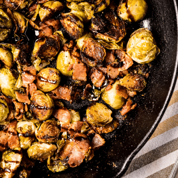 Skillet of glazed smoked Brussels sprouts.