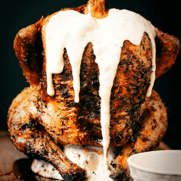 Beer can chicken covered in beer cheese.