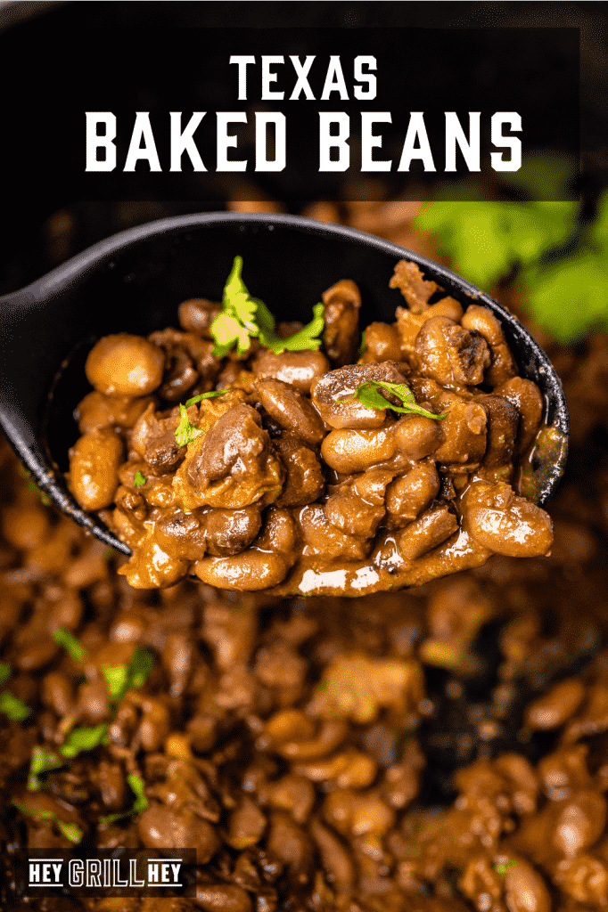 Texas baked beans on a black spoon with text overlay - Texas Baked Beans.