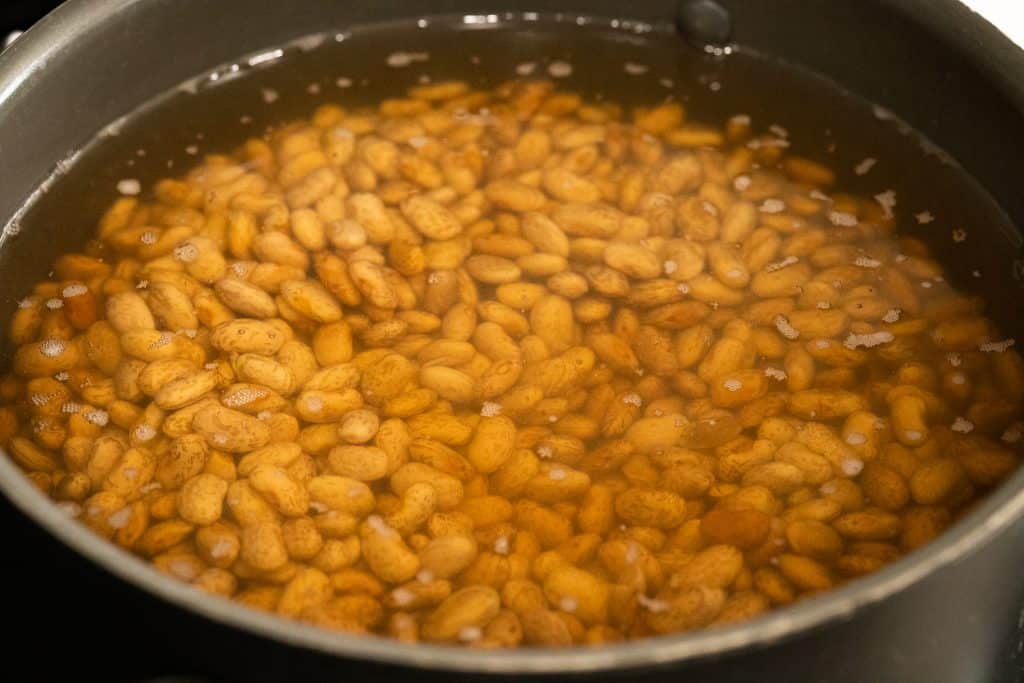 Beans soaking in a pot of water.