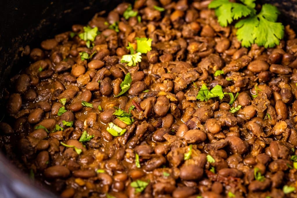 Large skillet full of Texas baked beans.