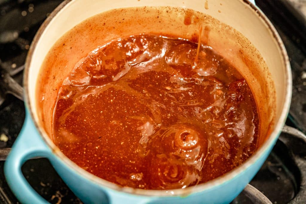 Ingredients for honey chipotle BBQ sauce in a large pot.