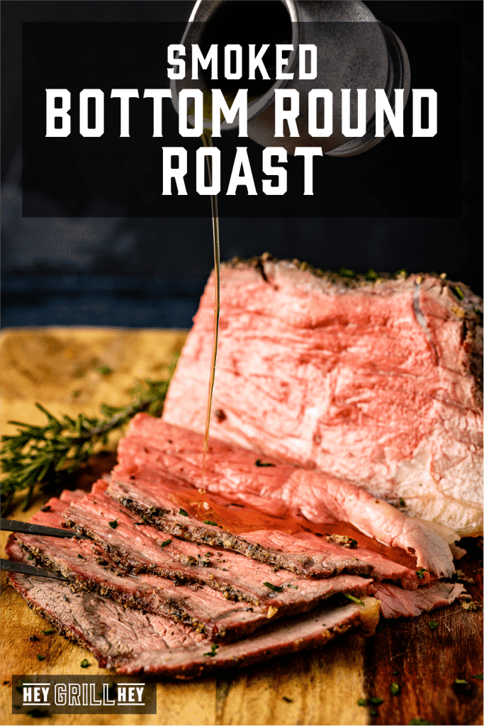 Melted garlic herb butter being drizzled on a smoked and sliced bottom round roast with text overlay - Smoked Bottom Round Roast.