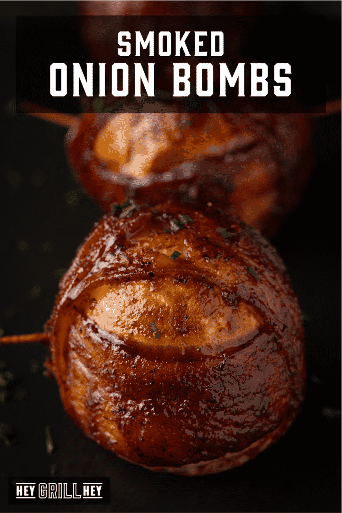 Smoked onion bombs wrapped in bacon with text overlay - Smoked Onion Bombs.