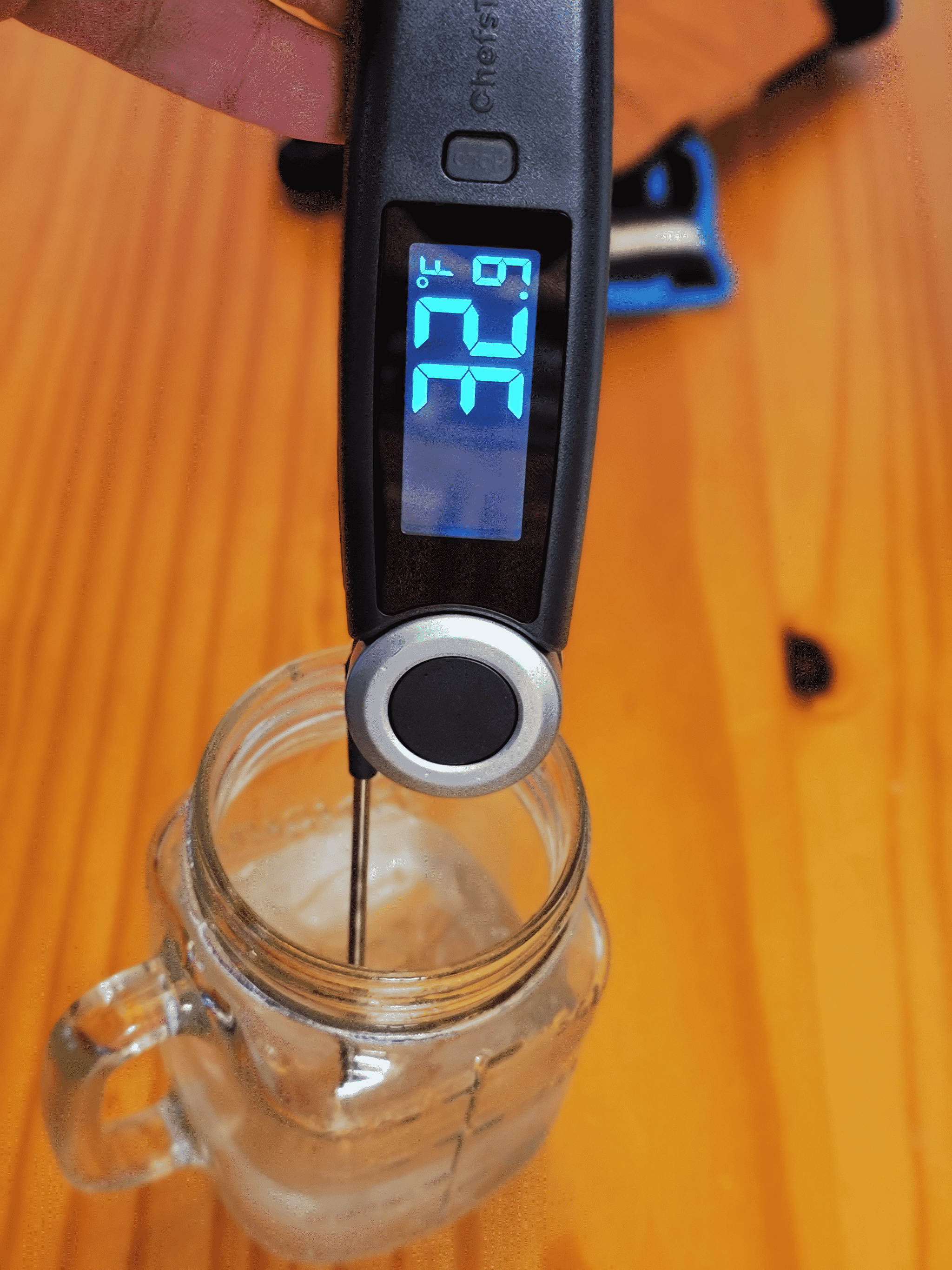thermometer reading the temperature of ice water