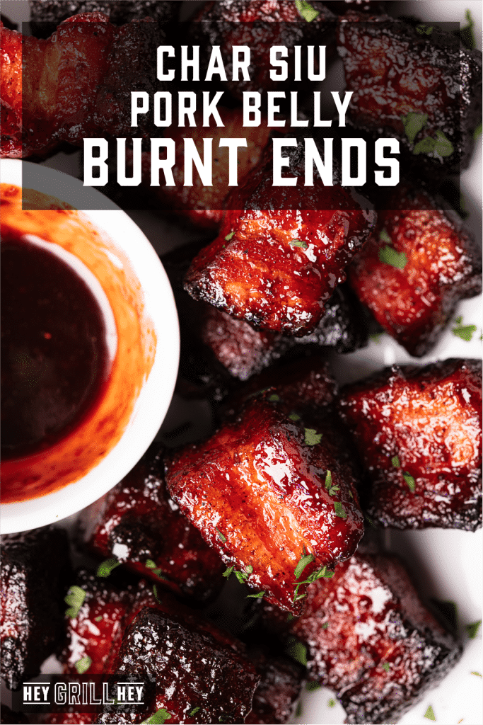 Char Siu pork belly burnt ends next to a small bowl of char siu glaze with text overlay - Char Siu Pork Belly Burnt Ends.