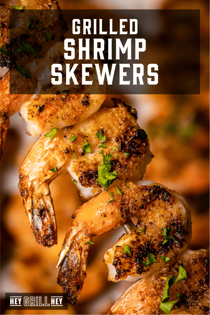 Grilled shrimp on a skewer with text overlay - Grilled Shrimp Skewers.