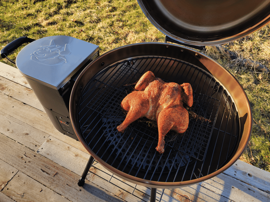 chicken on the grill grates of the recteq RT-B380