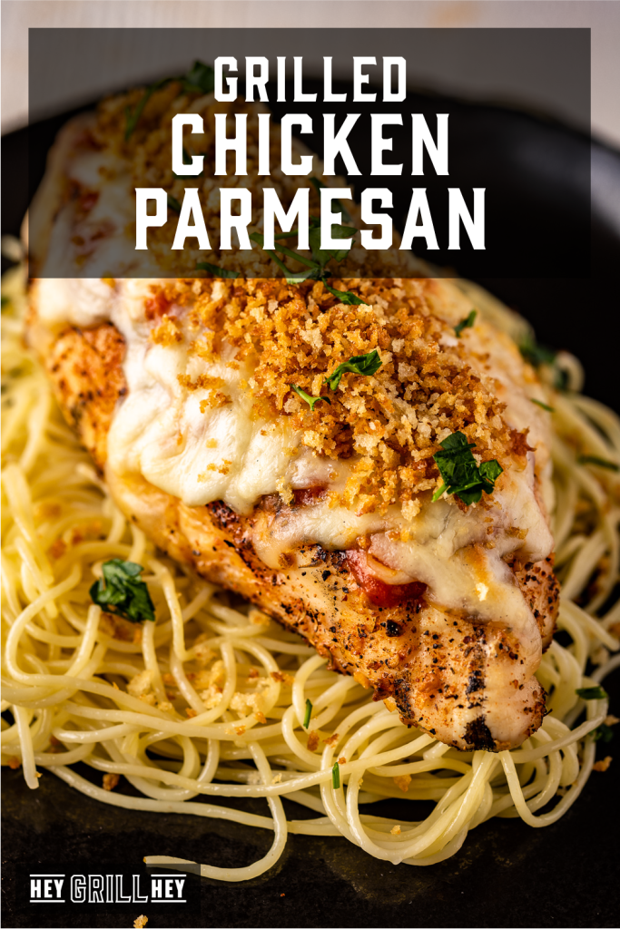 Grilled chicken parmesan over a bed of noodles with text overlay - Grilled Chicken Parmesan.