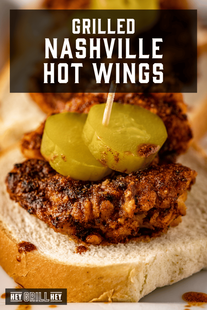 Nashville hot wings on a slice of bread topped with pickles with text overlay - Grilled Nashville Hot Wings.